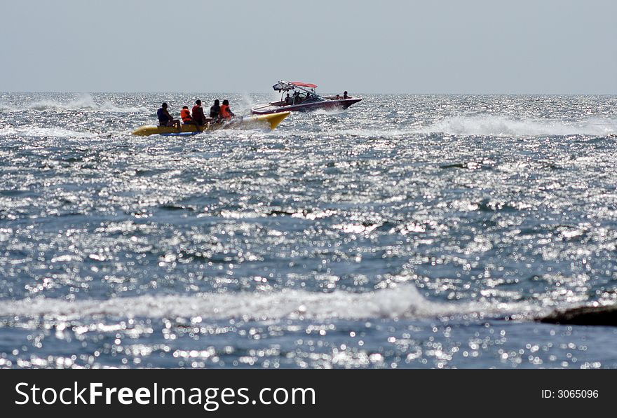 Sea, summer holiday on a high-speed boat. Pleasant morning light.