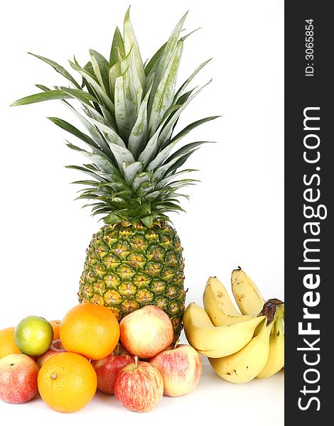 Fresh pineapple and fruits on white background