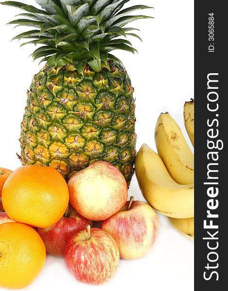 Fresh pineapple and fruits on white background