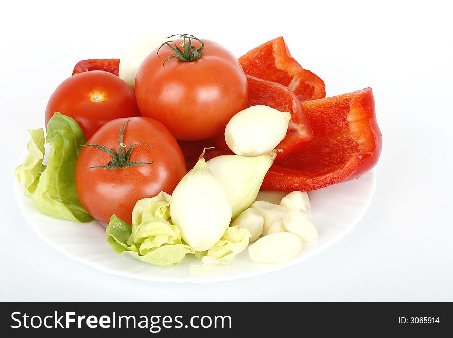 Tomatoes, onion and red pepper on white. Tomatoes, onion and red pepper on white