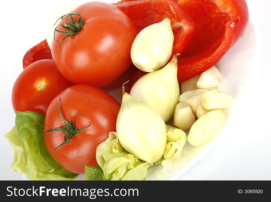 Tomatoes, onion and red pepper on white. Tomatoes, onion and red pepper on white