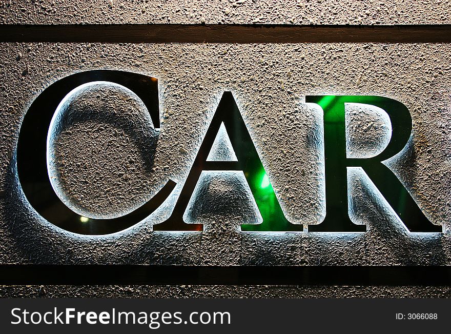 CAR word glow on textured wall