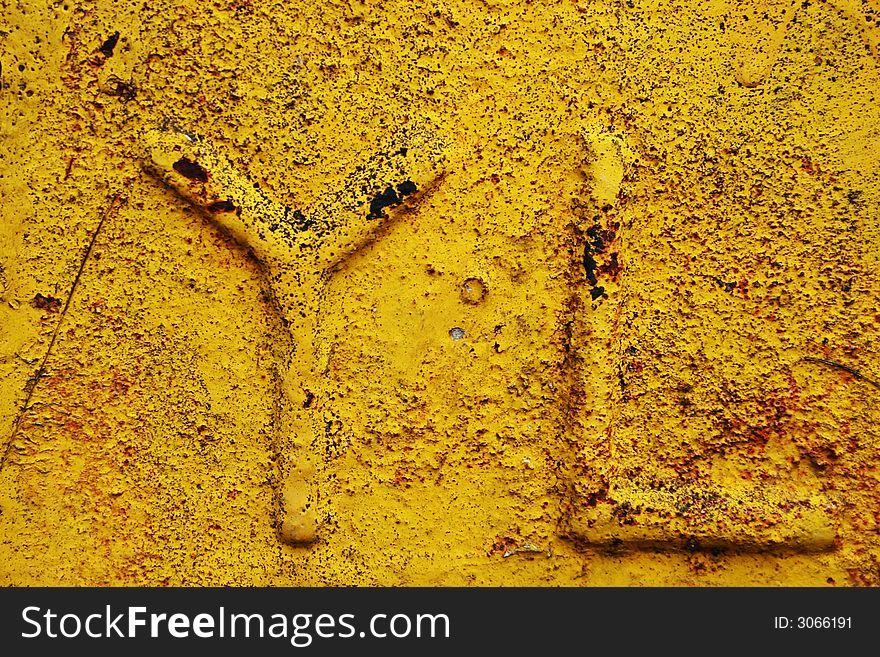 YL alphabet grunge on yellow paint texture