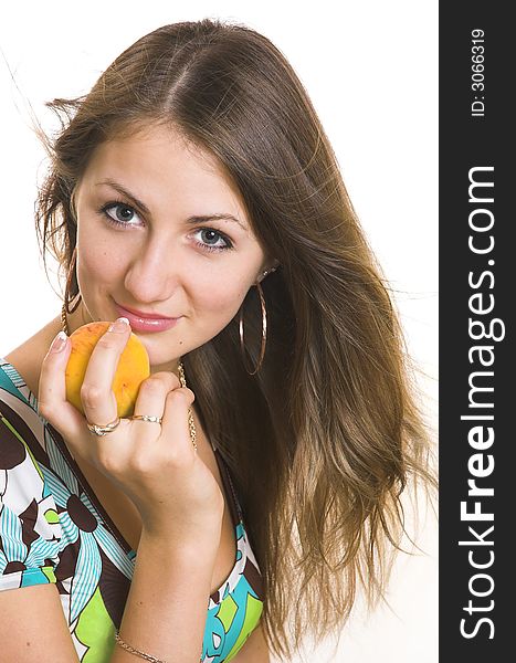 The young beautiful girl with a peach on a white background. The young beautiful girl with a peach on a white background