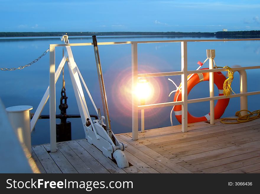 Anchor, lamp and life buoy on a lower deck