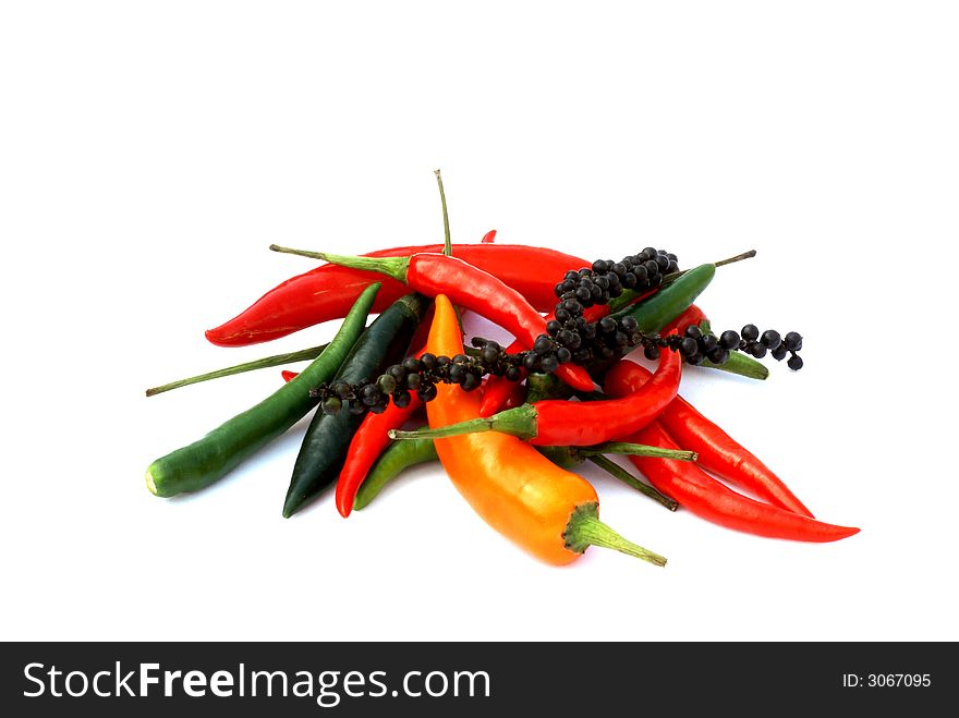 Different kinds of pepper on a white background. Different kinds of pepper on a white background.