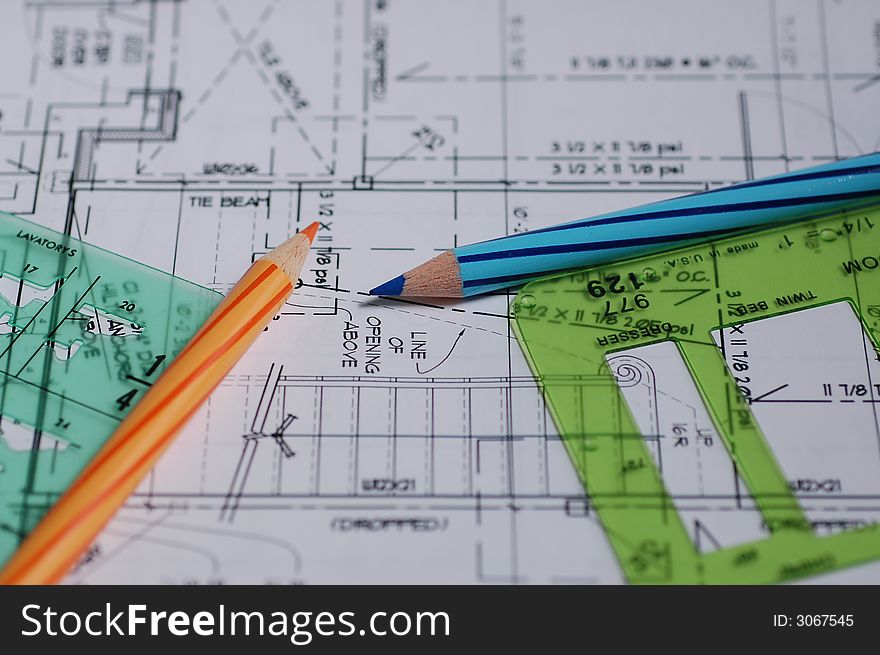 Architectural drawings with templates and pencils.