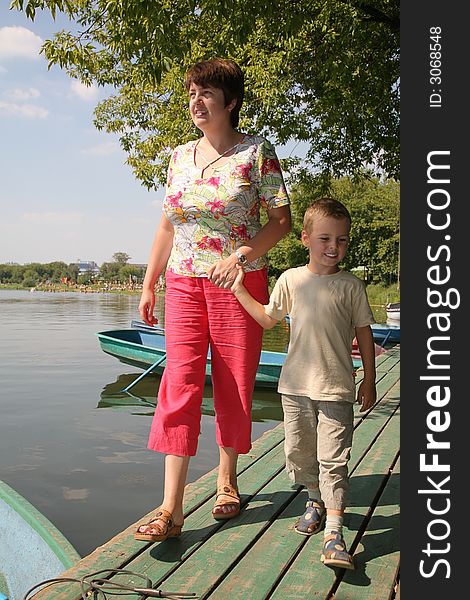 Woman with the boy on the moorage