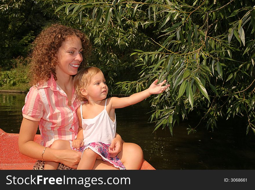 Mother with the daughter in the boat