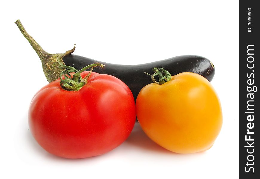 Eggplant with tomatoes on a white studio background