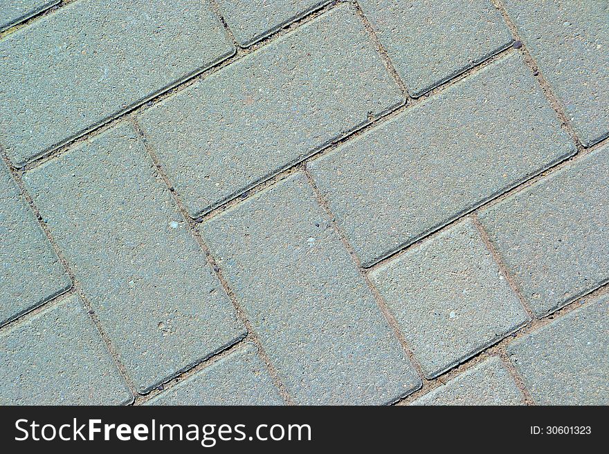Gray paving bricks on a walkway