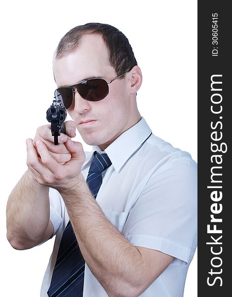 Professional man who keeps a gun pointing it at a target on a white background. Professional man who keeps a gun pointing it at a target on a white background