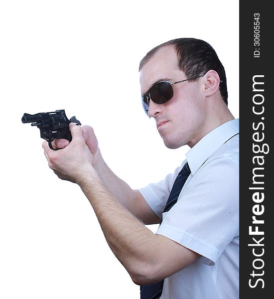 Professional man who keeps a gun pointing it at a target on a white background. Professional man who keeps a gun pointing it at a target on a white background