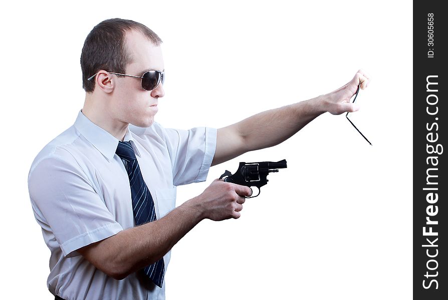 Professional man who keeps a gun pointing it at a target on a white background. Professional man who keeps a gun pointing it at a target on a white background