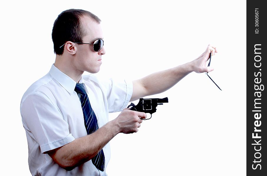 Professional man who keeps a gun pointing it at a target on a white background. Professional man who keeps a gun pointing it at a target on a white background