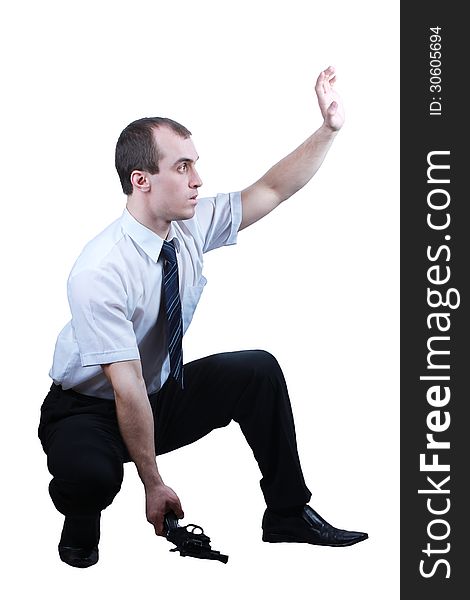 Professional man who keeps a gun pointing it at a target on a white background. Professional man who keeps a gun pointing it at a target on a white background