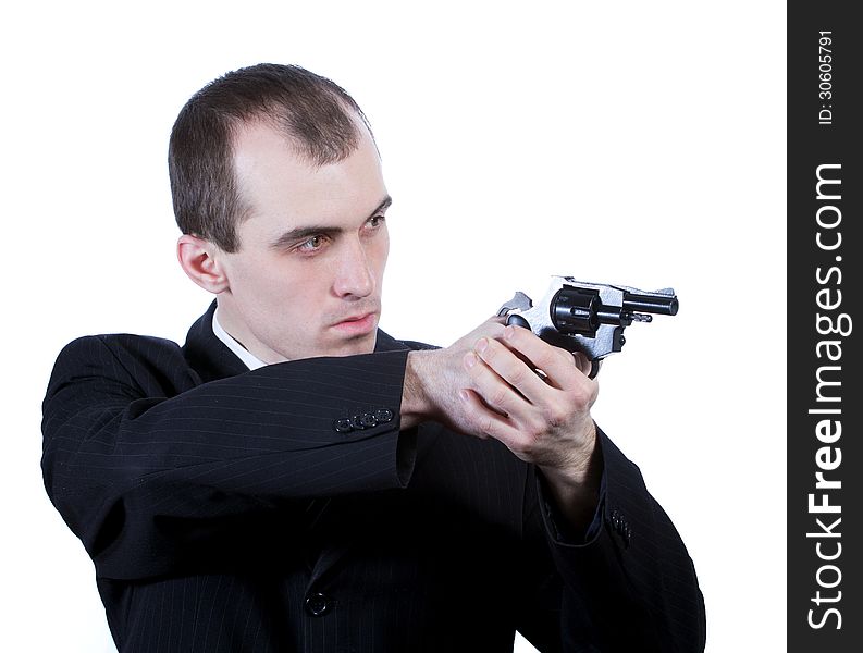 Professional man who keeps a gun pointing it at a target on a white background. Professional man who keeps a gun pointing it at a target on a white background