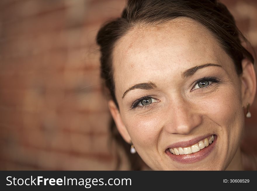 Young Woman With Beautiful Green Eyes And Brown Hair