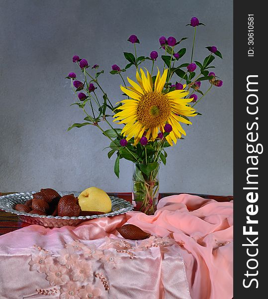 Flowers and fruit in still life concept
