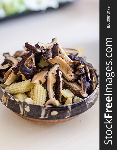 Shiitake mushrooms in a ceramic bowl