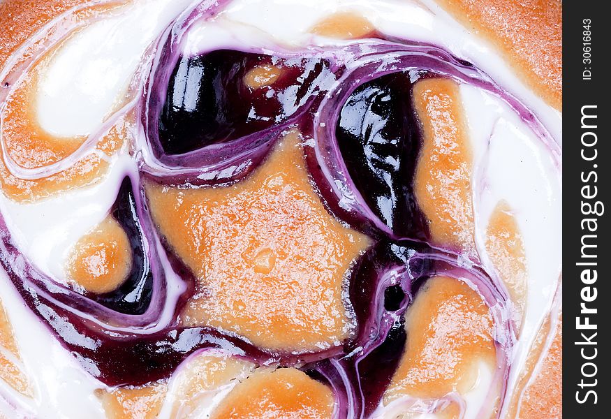 Cake with blueberry jam and cream.