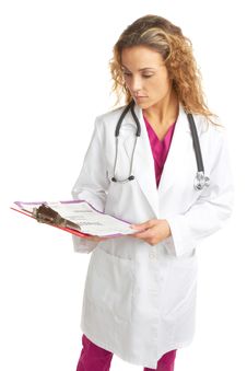 Serious Young Female Doctor Looking At Chart Royalty Free Stock Photos Serious Young Female Doctor Looking At Chart Royalty Free Stock Photos