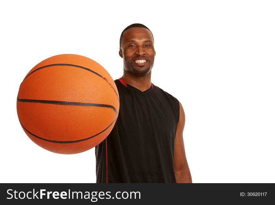 Happy young basketball player with focus on the ball isolated on white.