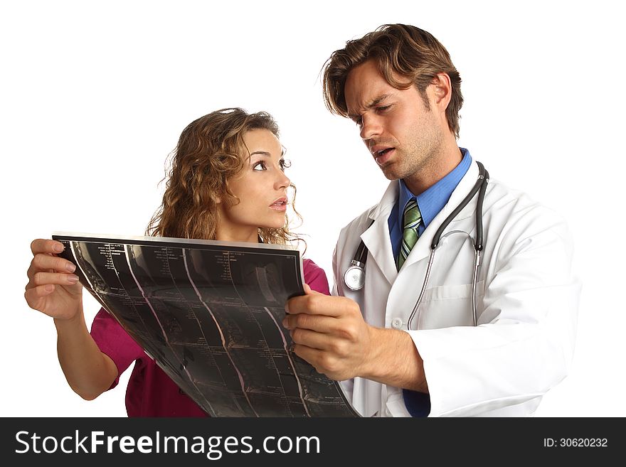 Nurse and doctor looking at x rays with bad news