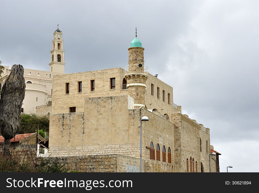 Proximity of the Christian St. Peter's Church and the Muslim Jama-el-Bahr Mosque (Sea Mosque) in Jaffa, Israel; March 4, 2013. Proximity of the Christian St. Peter's Church and the Muslim Jama-el-Bahr Mosque (Sea Mosque) in Jaffa, Israel; March 4, 2013