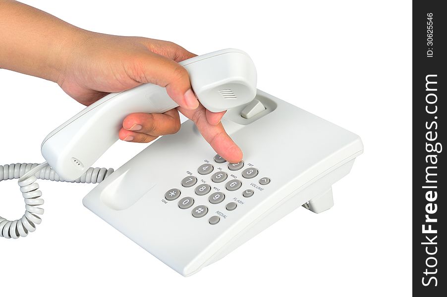 The businessman calling by desktop telephone. The businessman calling by desktop telephone