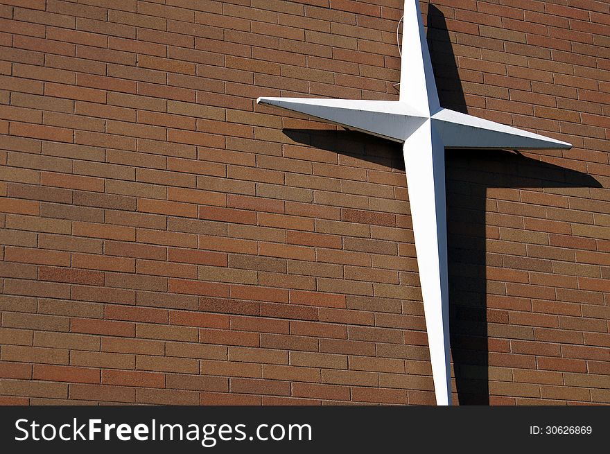 White Cross Red Brick Wall