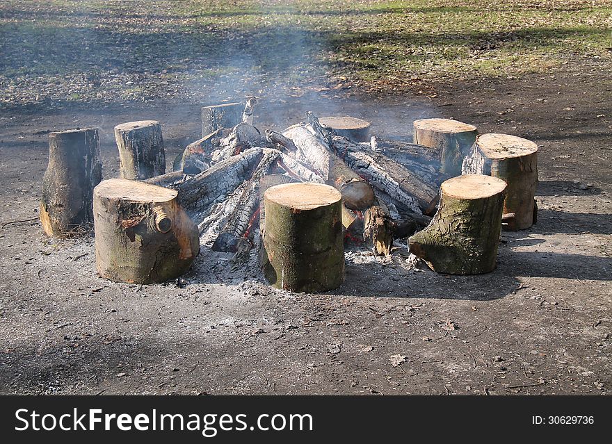 The Smoking Embers of a Warming Wood Log Fire.