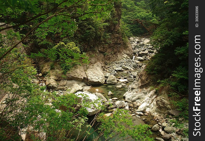 River in Japanese mountains flowing through rocks. River in Japanese mountains flowing through rocks