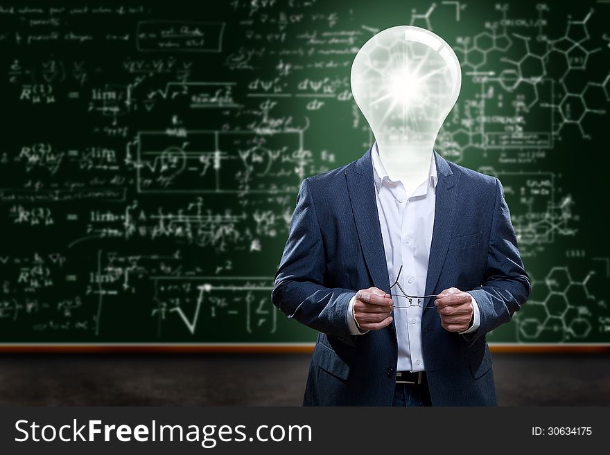 Teacher or college professor with a light bulb head in front of a chalkboard with complex math problems. Teacher or college professor with a light bulb head in front of a chalkboard with complex math problems.