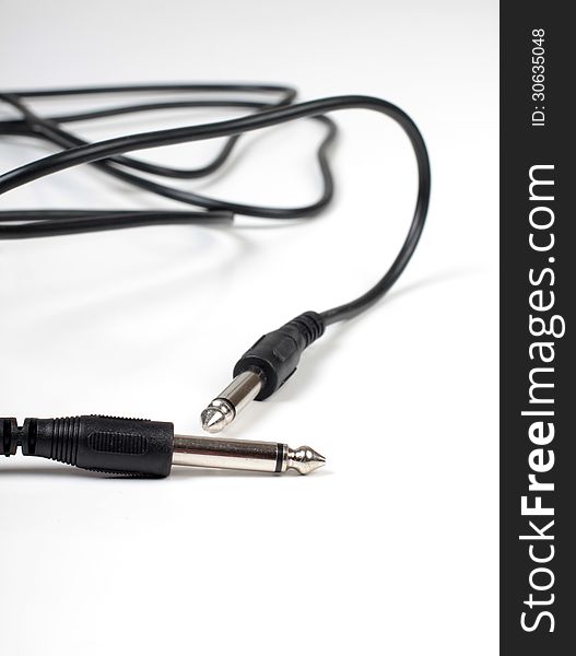 Color photo of an electrical cord with plug