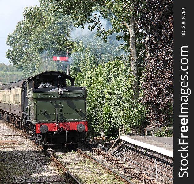 A Steam Engine Pulling a Train Backwards into a Station. A Steam Engine Pulling a Train Backwards into a Station.