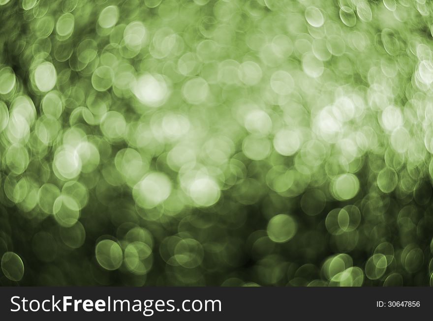 Abstract circular green bokeh background.