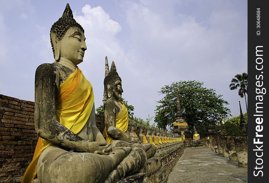 Buddha statues in a row at Wat Yai-Chaimongkol, Buddhist temple in Ayutthaya - Thailand