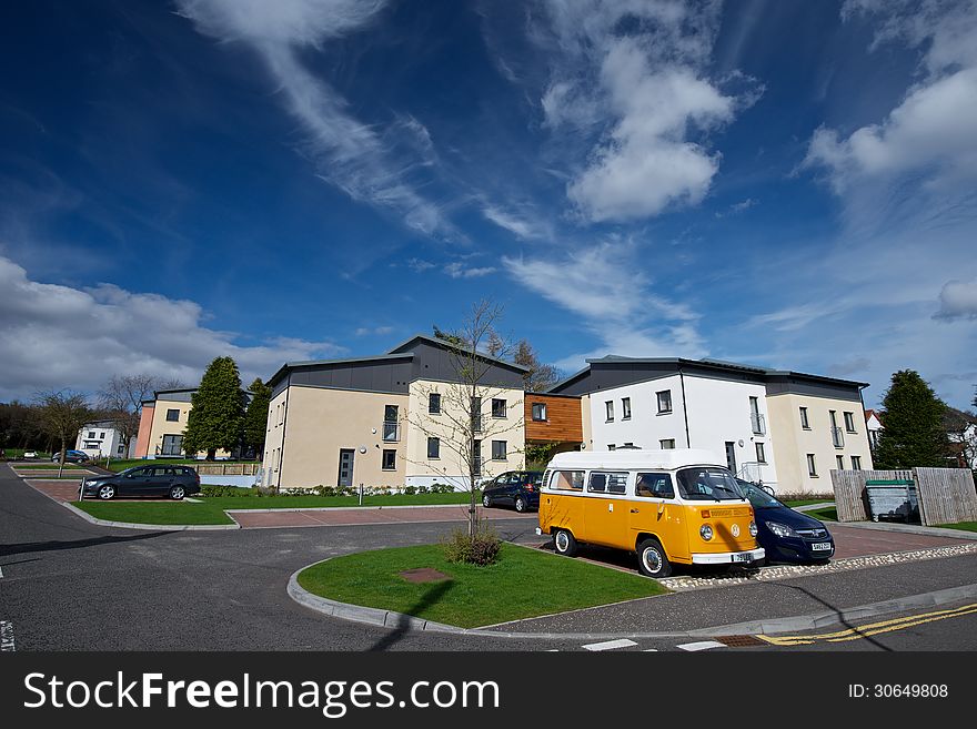 An Orange van under lovely blue sky in Dundee.