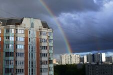 Landscape With A Panel High-rise House On A Dark Sky With A Rainbow. Double Rainbow In The Dark Sky. A Storm Cloud Over The City. Royalty Free Stock Photo