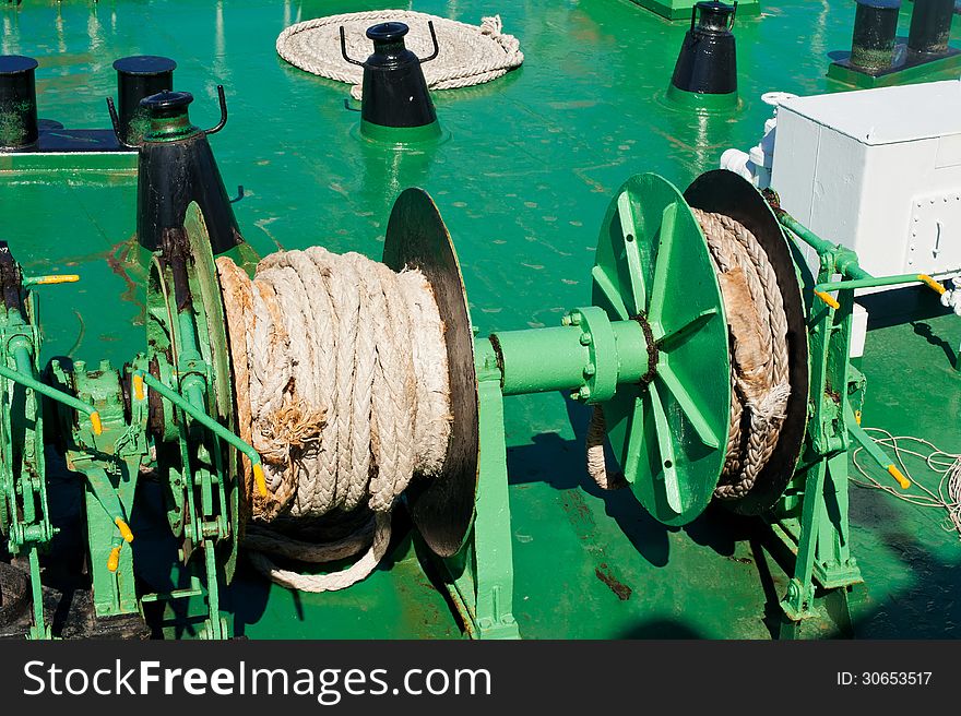 Traveling by sea. Close up rope on mechanism at ferry boat deck. Traveling by sea. Close up rope on mechanism at ferry boat deck