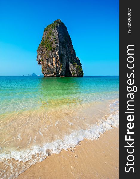 Tropical beach landscape with rock formation island and ocean. Pranang cave beach, Railay, Krabi, Thailand. Tropical beach landscape with rock formation island and ocean. Pranang cave beach, Railay, Krabi, Thailand