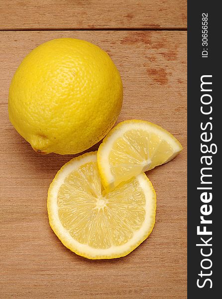 Lemon fruit shot with wooden texture background