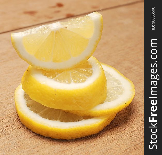 Lemon fruit shot with wooden texture background