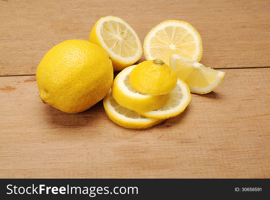 Lemon fruit shot with wooden texture background