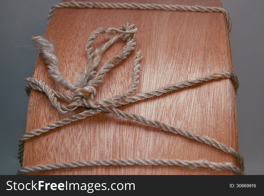 Wood background with rope knot