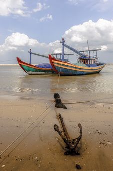 Fishing Boats And Anchor At Shore-line Stock Photos Fishing Boats And Anchor At Shore-line Stock Photos