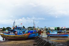 Fishing Boats In Harbor With The Jetty At Foreground Stock Images Fishing Boats In Harbor With The Jetty At Foreground Stock Images