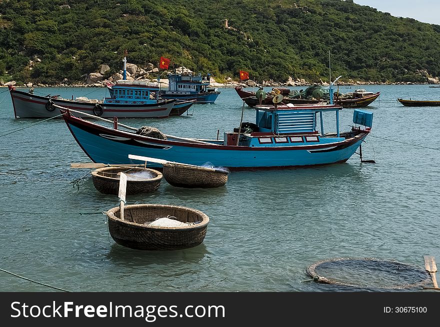 Fishing boats and coracles in the bay at Binh Thuan Vietnam