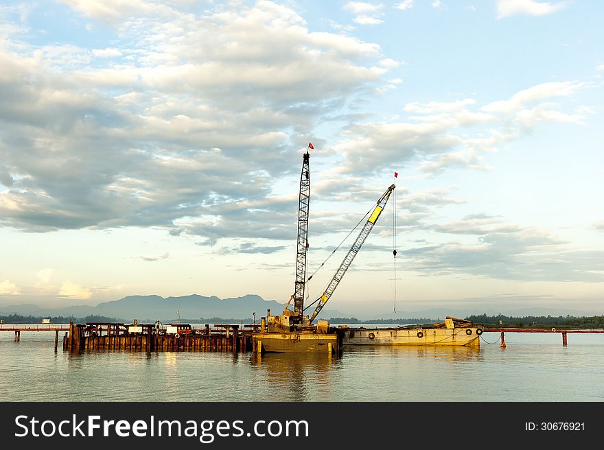 Crane at construction site on river of Hoi An Vetnam